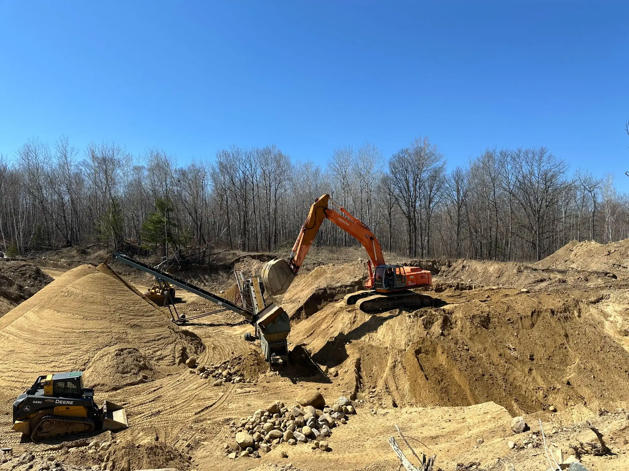 Shepard Excavating equipment moving sand and screening material at the pit